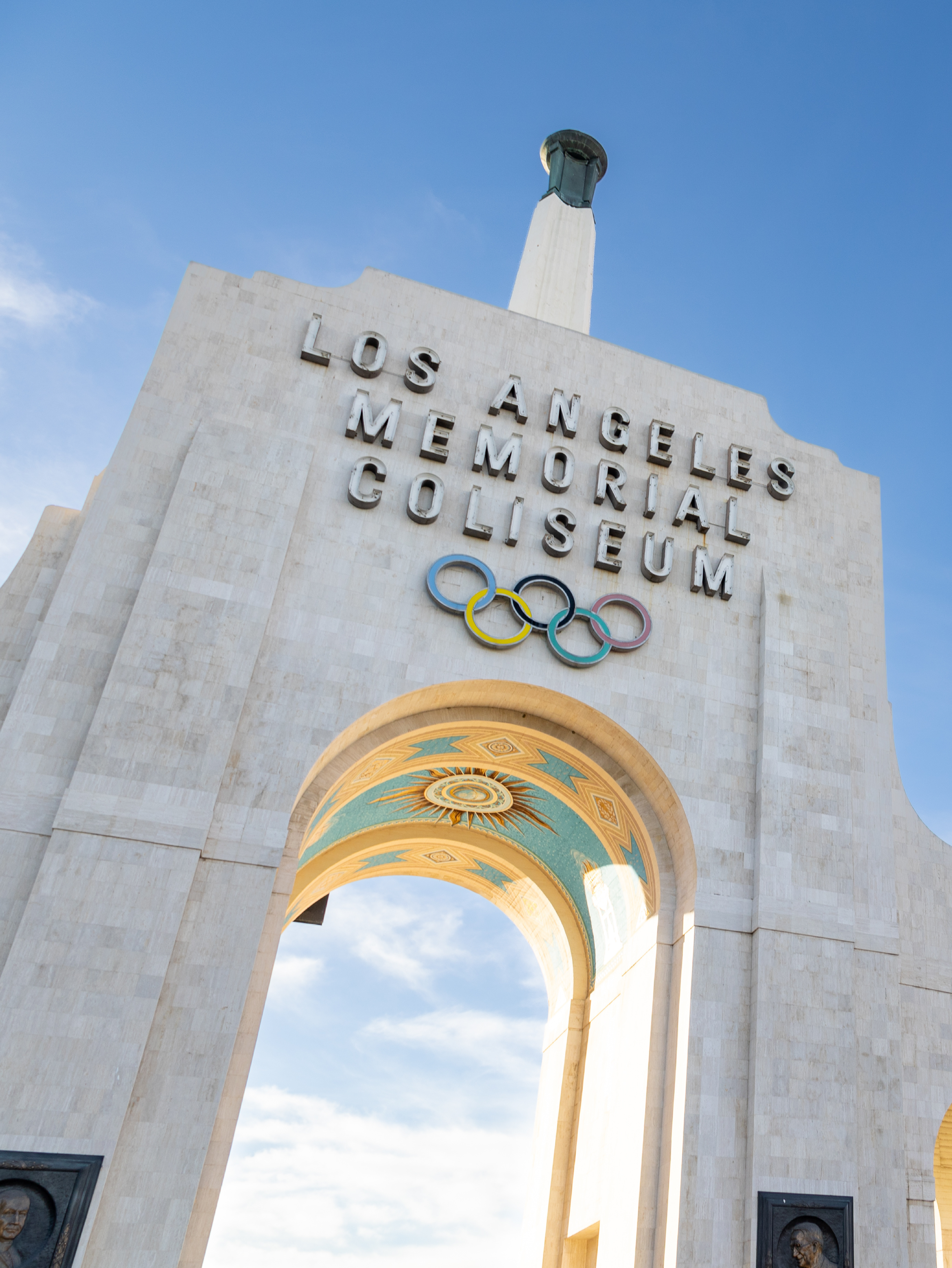 Photo of the Los Angeles Memorial Coliseum with the Olympic Rings